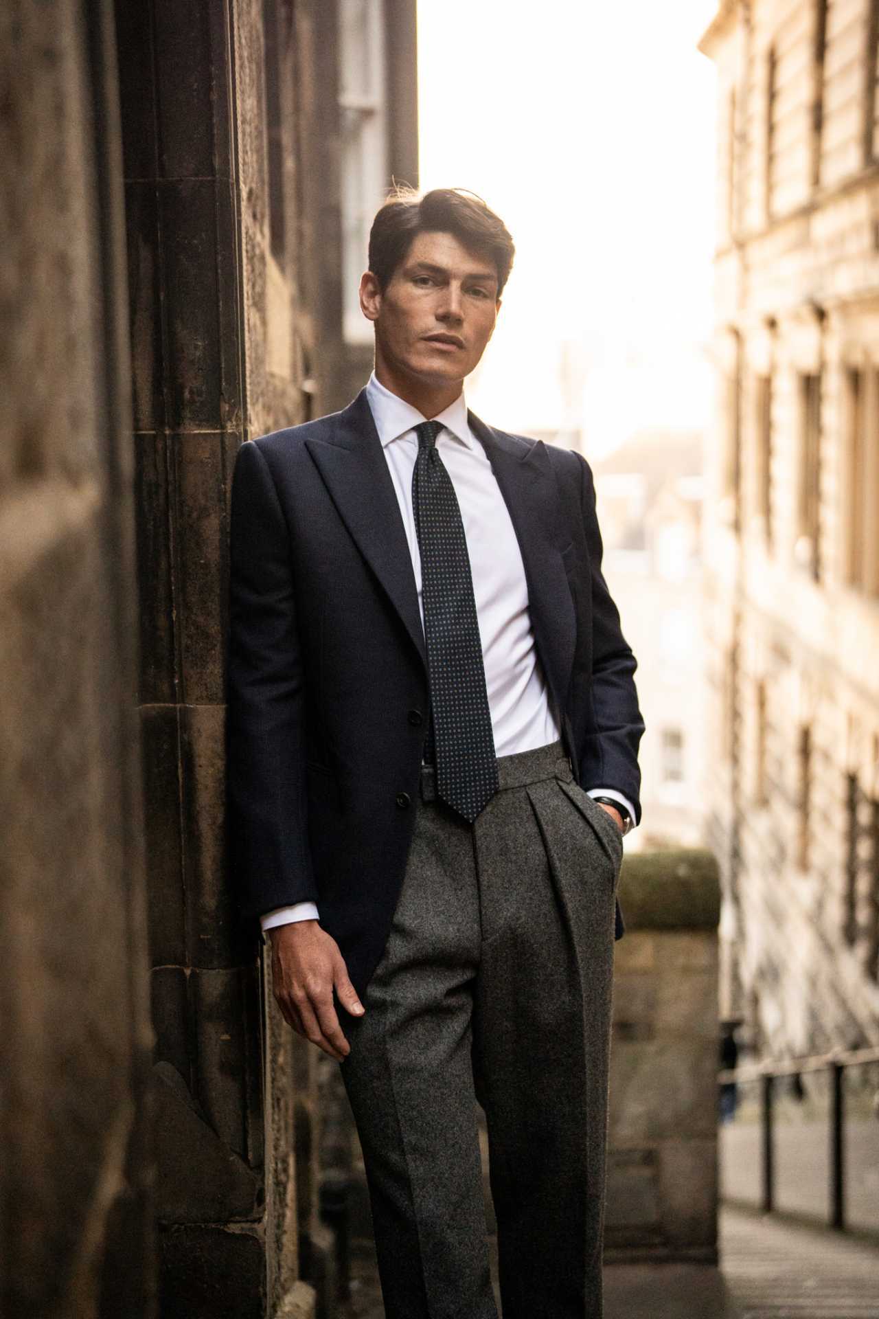 Model wearing Kit Blake AW25 trousers