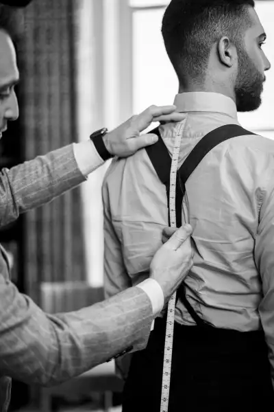 Edward Sexton Creative Director Dominic Sebag Montefiore measures a bespoke client