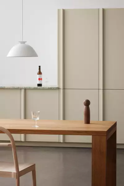 The Column kitchen by Inge Semp&eacute; breaks convention with unexpected integrated vertical handles, soft forms, and harmonious materials