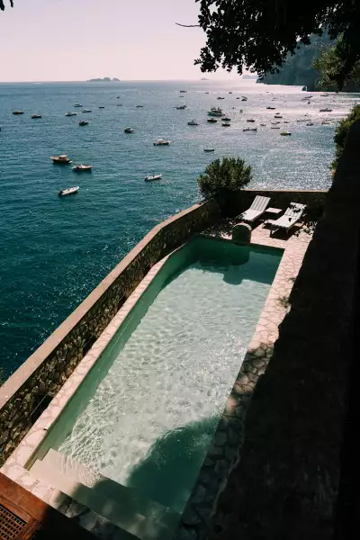 A private cliffside pool overlooking the Amalfi Coast &mdash; the essence of Italy&rsquo;s understated coastal luxury.