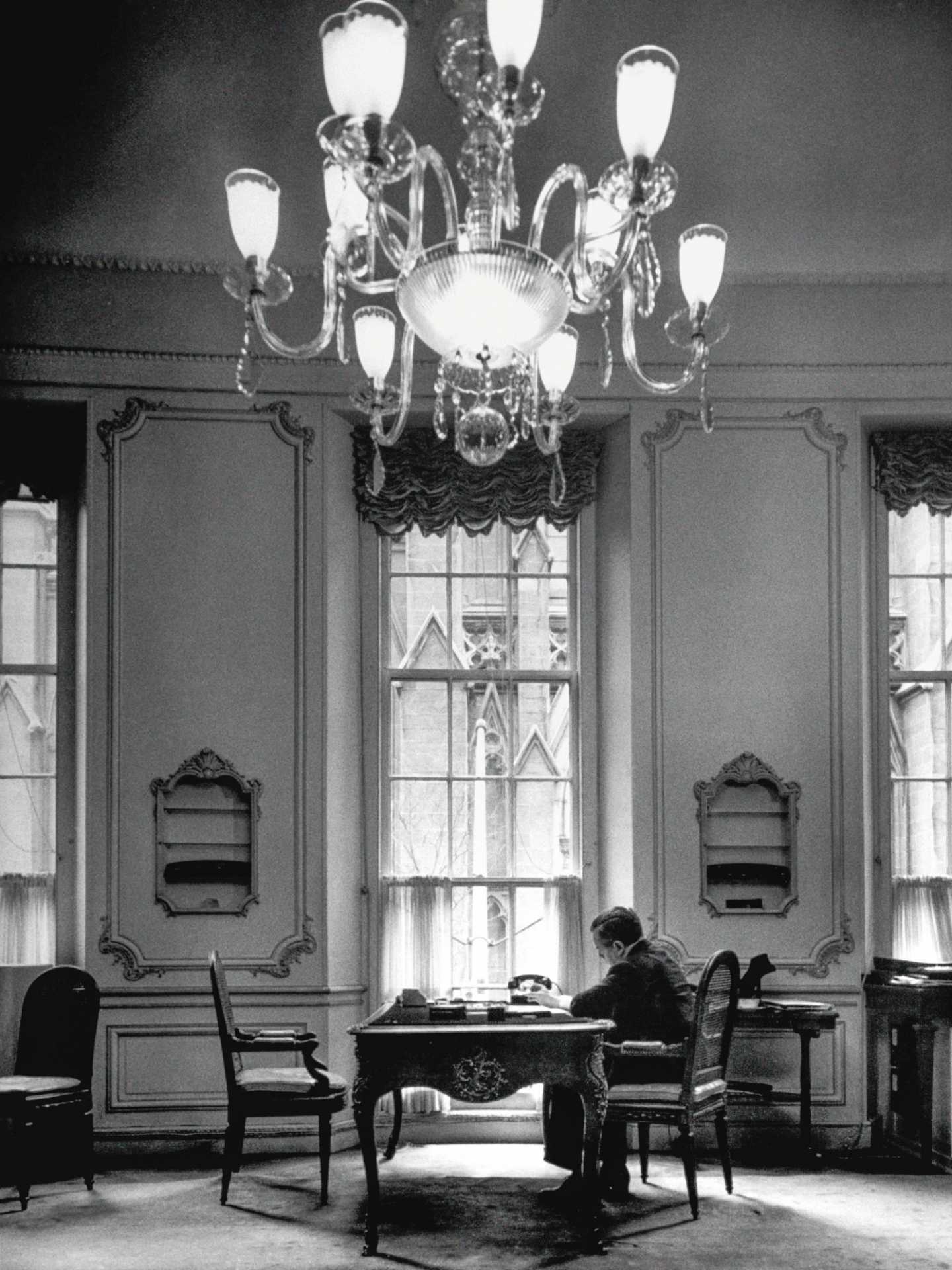 Harry Winston sitting in a townhouse opposite St Patrick's Cathedral, where he was a guest as a young man.