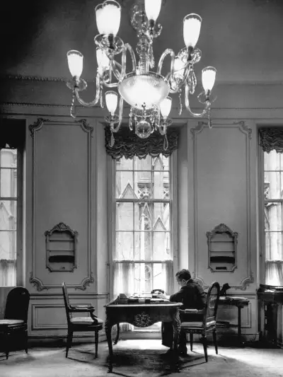 Harry Winston sitting in a townhouse opposite St Patrick's Cathedral, where he was a guest as a young man.