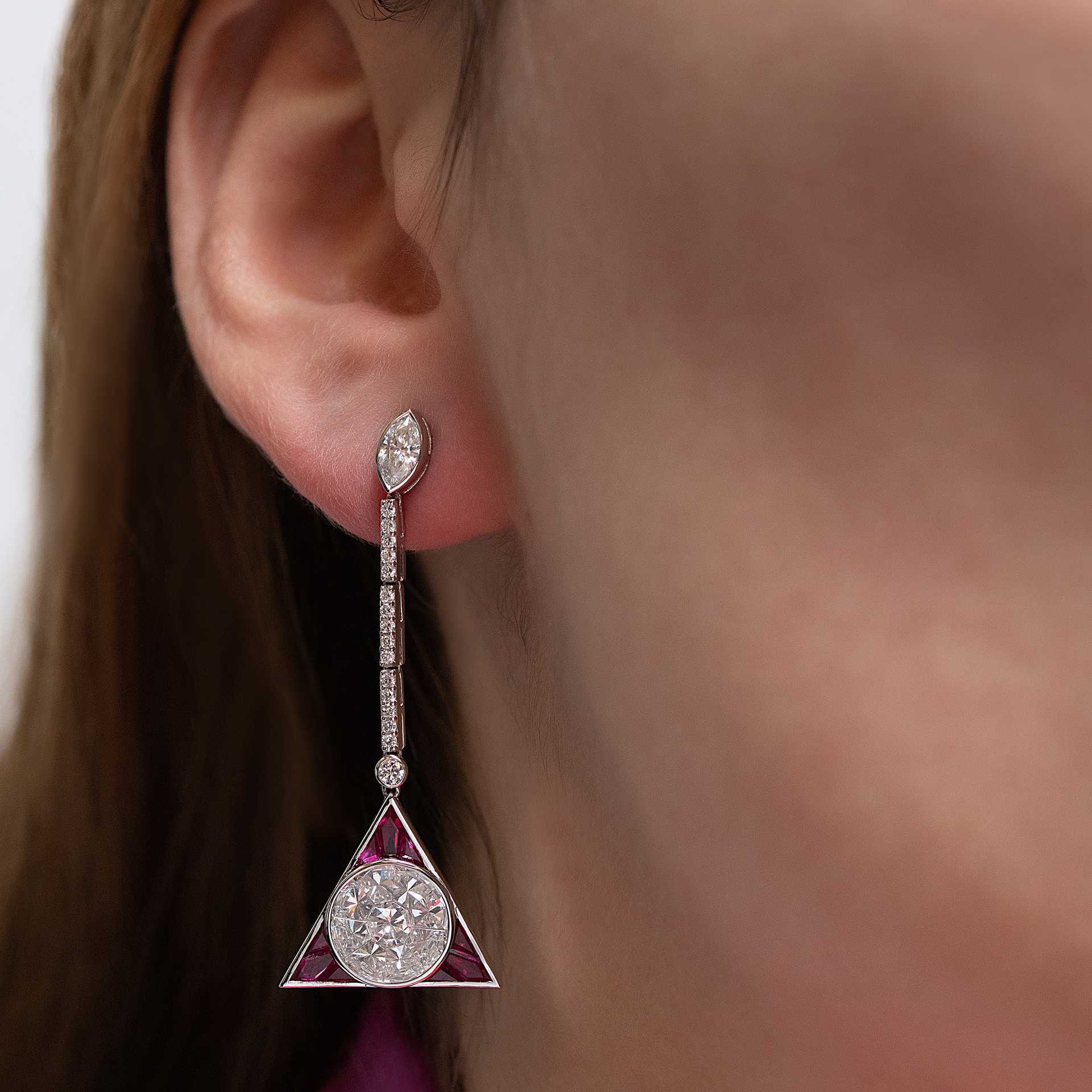 Lot 184: a pair of ruby and diamond Art Deco-style triangular drop ear pendants, estimate £4,000-£6,000.