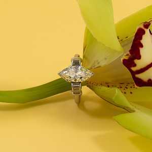 Lot 209: a marquise-cut diamond ring, estimate £1,500-£2,500.
