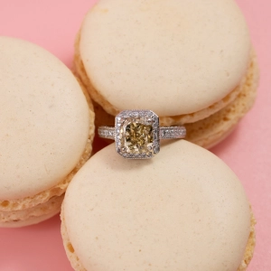 Lot 216: a yellow diamond halo-style cluster ring, estimate £12,000-£16,000.