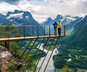 A couple overlooking an Alpine scene