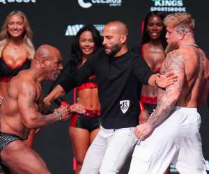 Nakisa Bidarian between Mike Tyson and Jake Paul