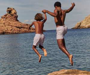 Vilebrequin ‘mini turtles’ swimming shorts, £250; Vilebrequin ‘mini turtles’ boys’ swimming shorts, £125, vilebrequin.com