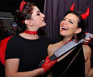 Two ladies wearing Halloween costumes_2