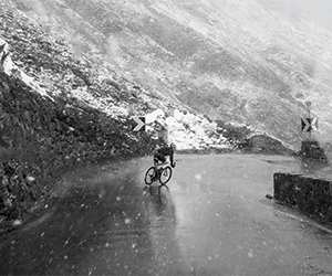 Man cycling in the rain