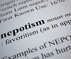 Image of the word 'nepotism' in a dictionary