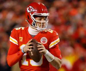 Patrick Mahomes #15 of the Kansas City Chiefs looks to pass against the Cincinnati Bengals during the first quarter in the AFC Championship Game at GEHA Field at Arrowhead Stadium on January 29, 2023 in Kansas City, Missouri.