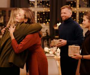 Family hugging at Christmas