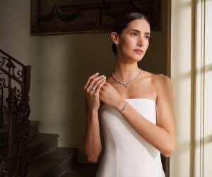 Model wears Harry Winston's latest Sparkling Cluster Collection suite.