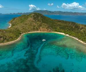 A cove with a lone moored boat in the BVI