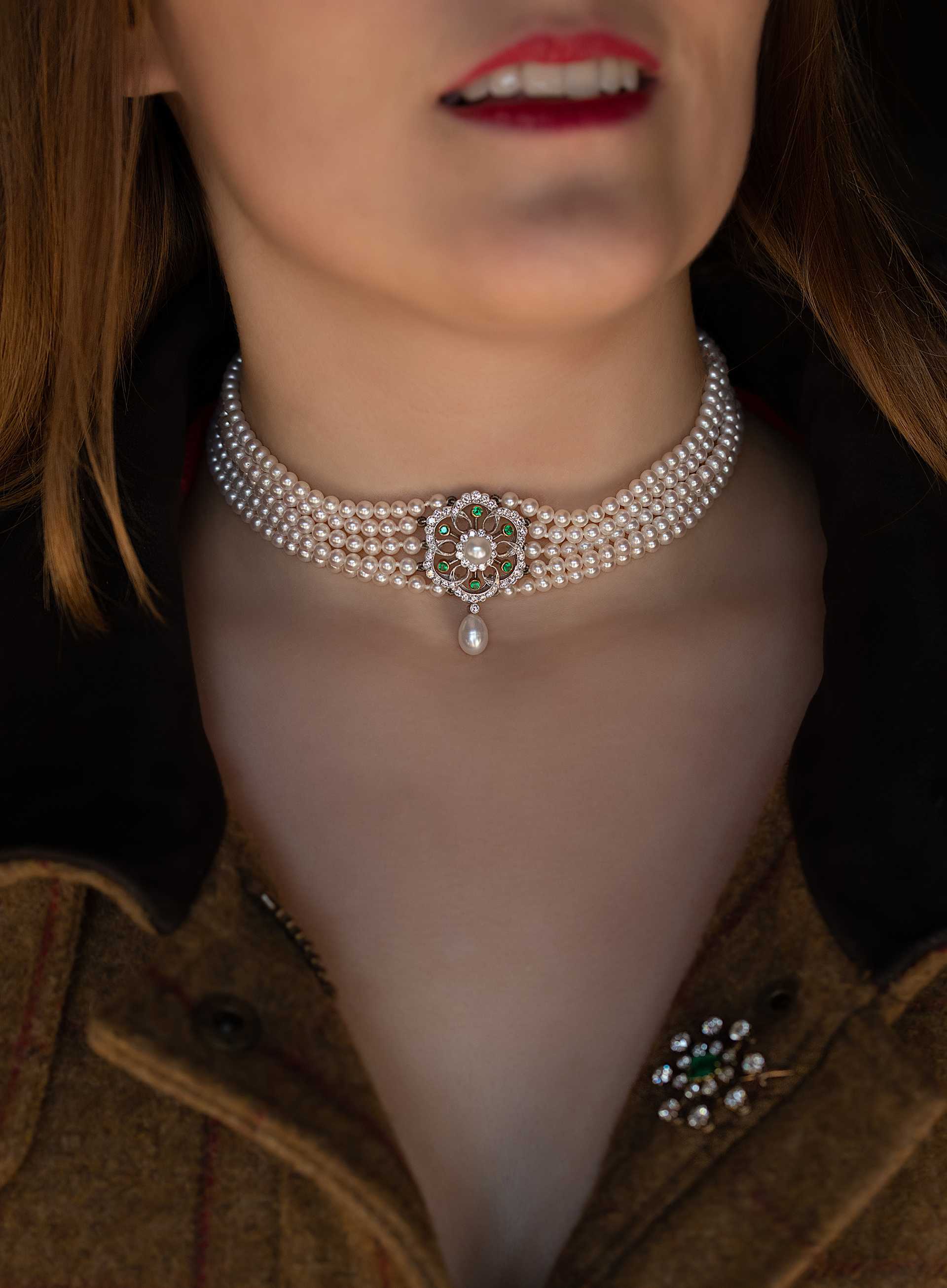 Lots 176 - A five row cultured pearl choker with diamond and emerald centrepiece estimate £1,00-£1,500 Lot170 - An early 20th century emerald and diamond brooch estimate £800-£1200