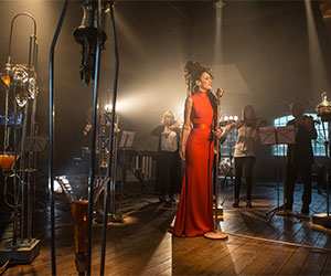 Woman singing in studio