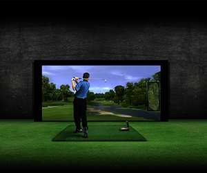 Man playing indoor golf simulator
