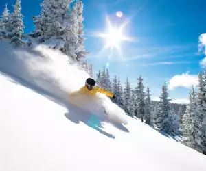 Skiing down Blue Sky Basin at Vail Resorts