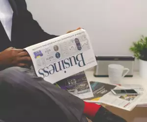 Man reading business newspaper