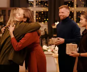 Family hugging at Christmas