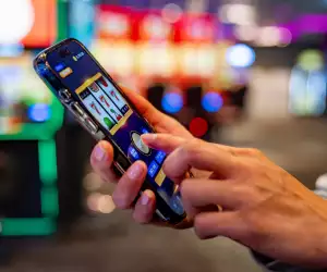Lady playing on an online slot app